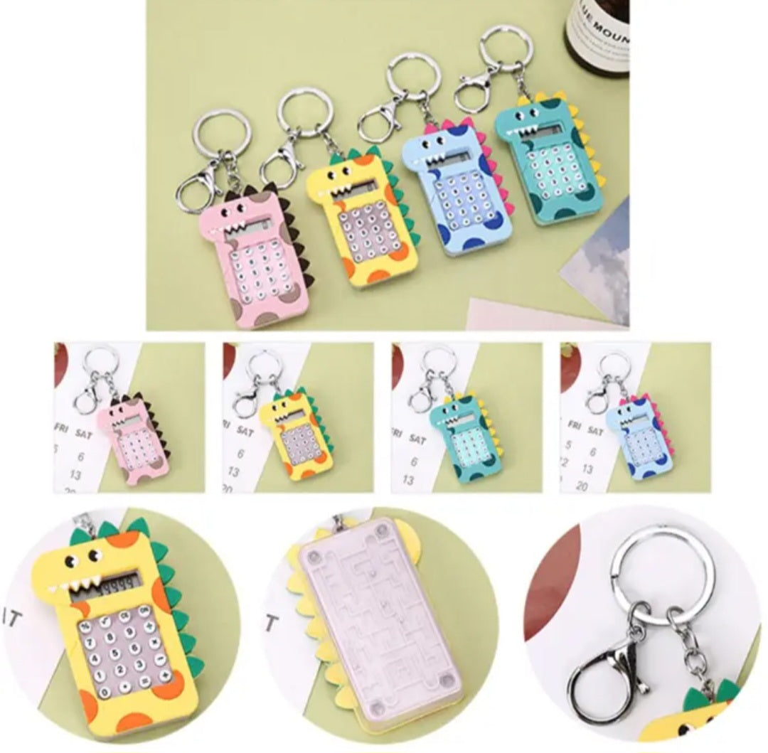 سلسلة مفاتيح على شكل آلة حاسبة صغيرة على شكل ديناصور